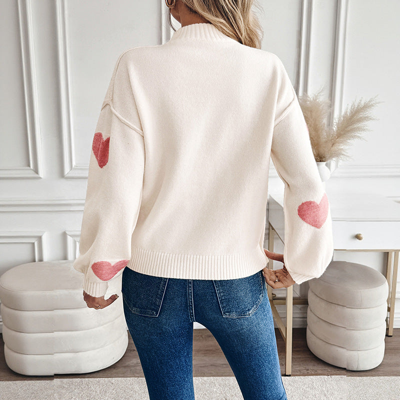 Sweater for women with knitted hearts and a high collar
